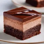 Delicious Chocolate Mousse Brownies topped with creamy mousse layer