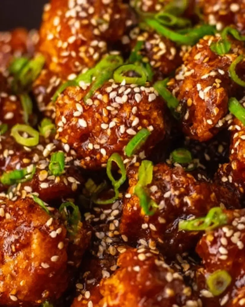 Crispy Korean Fried Cauliflower garnished with sesame seeds and green onions