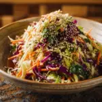 Crunchy Asian cabbage slaw with sesame dressing served in a bowl