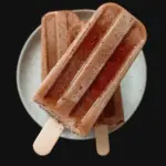 Delicious Fudgesicle ice cream treat on a stick, perfect for summer.