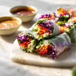 Fresh summer rolls served with two vibrant dipping sauces