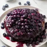 Baked cream cheese blueberry bombs fresh out of the oven, golden and delicious.