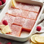 Delicious Raspberry Lemon Bars topped with fresh raspberries and lemon zest